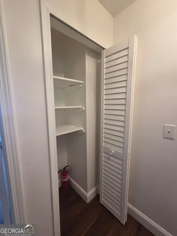 a view of a hallway with closet
