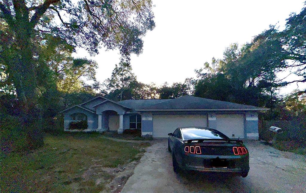 a house view with a car parked in front of a house