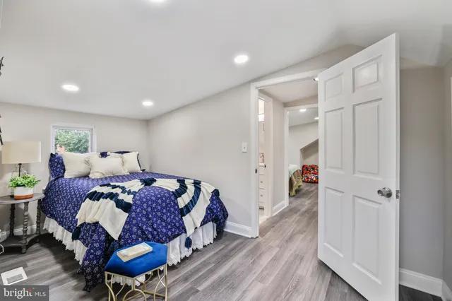 a bedroom with a bed and a table