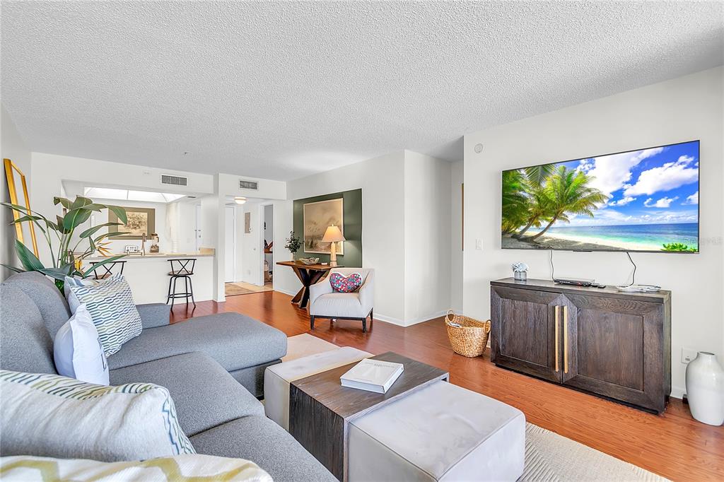 12200 Vonn Road, Unit 2206 Largo, FL 33774 - Photo 16 of 60 a living room with furniture a flat screen tv and a window