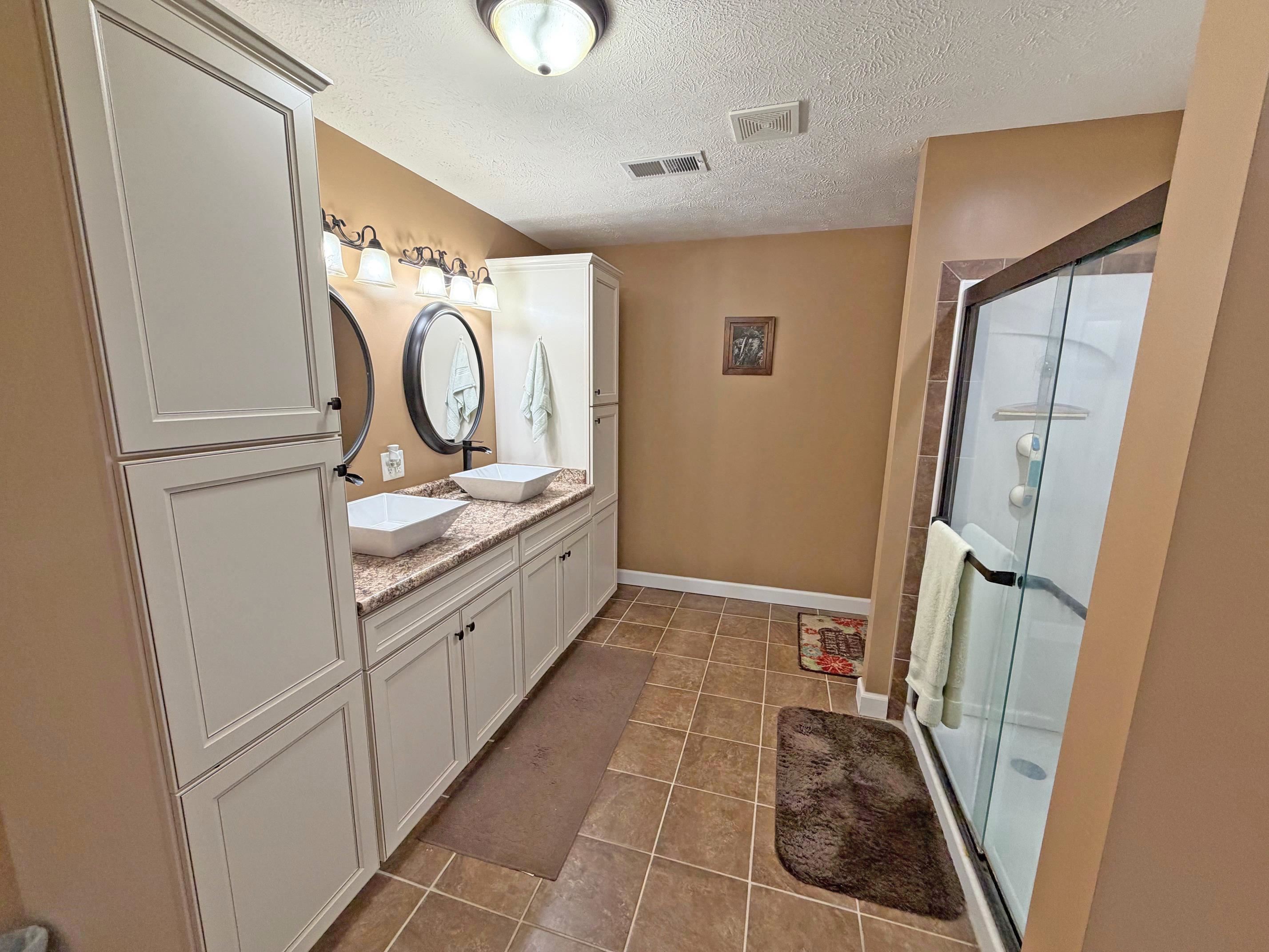 1255 Elm Road Adamsville, TN 38310 - Photo 14 of 32 a bathroom with a sink and a mirror