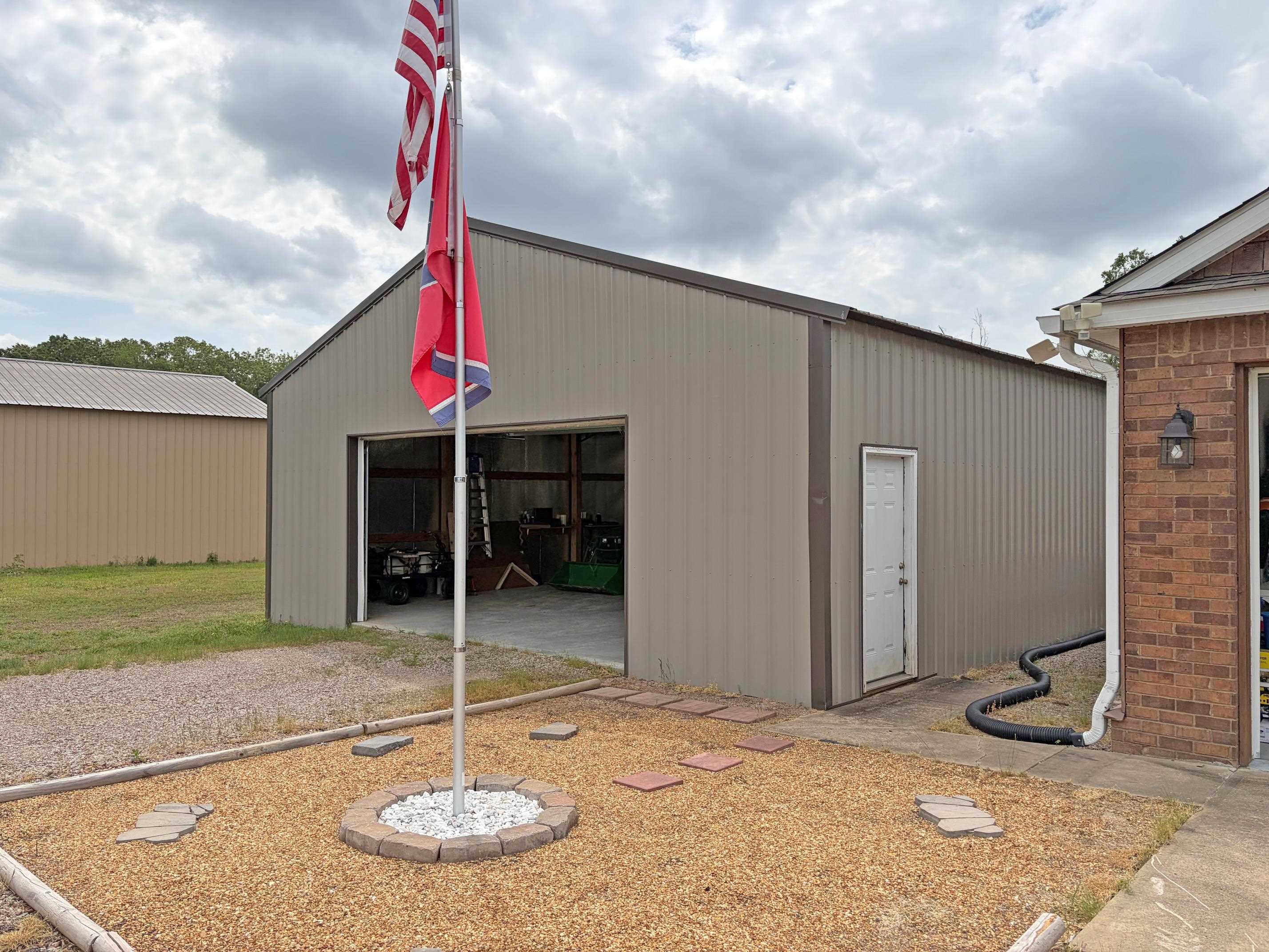 1255 Elm Road Adamsville, TN 38310 - Photo 25 of 32 a swimming pool with a outdoor seating