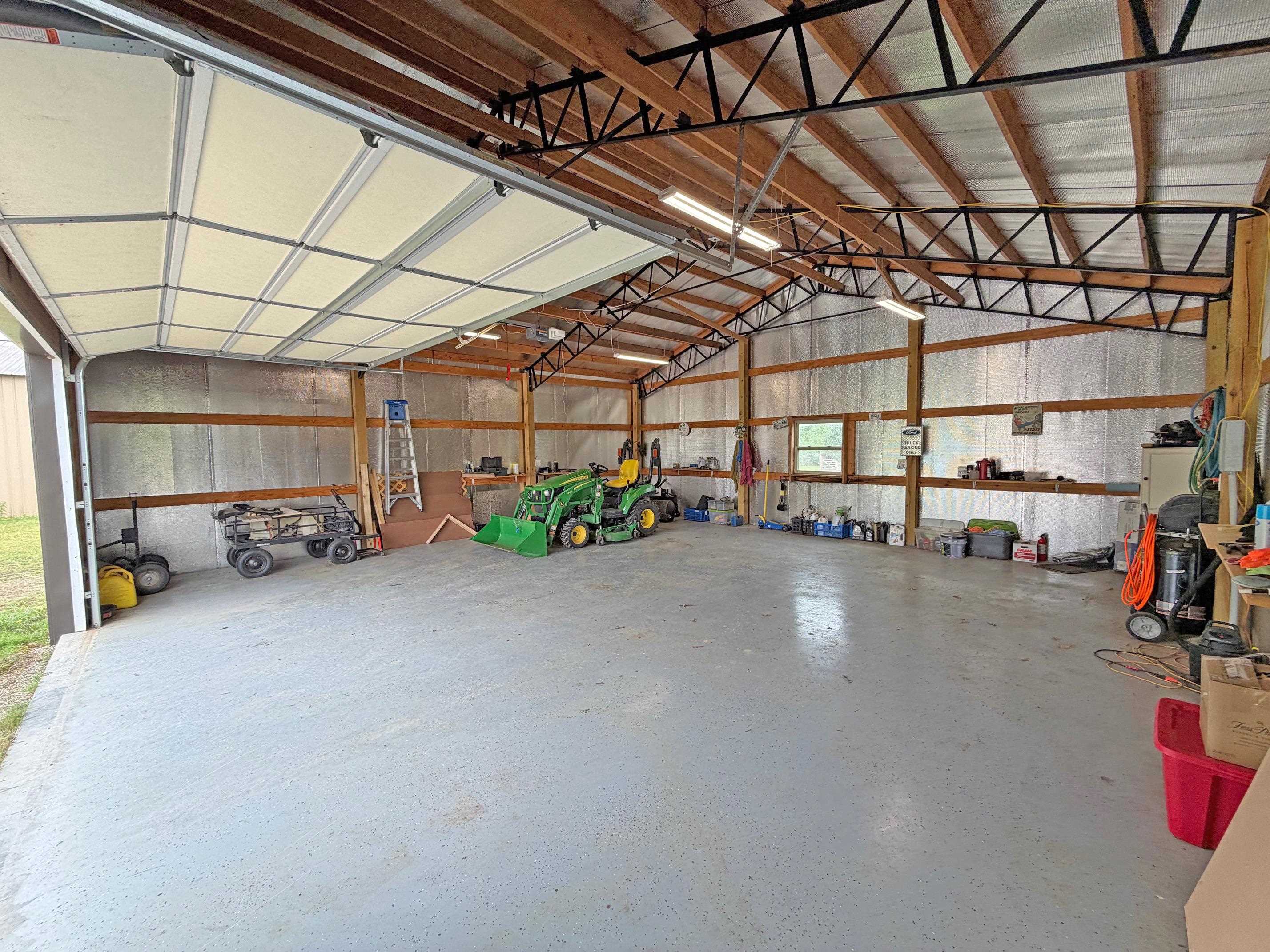 1255 Elm Road Adamsville, TN 38310 - Photo 26 of 32 a view of a garage with storage