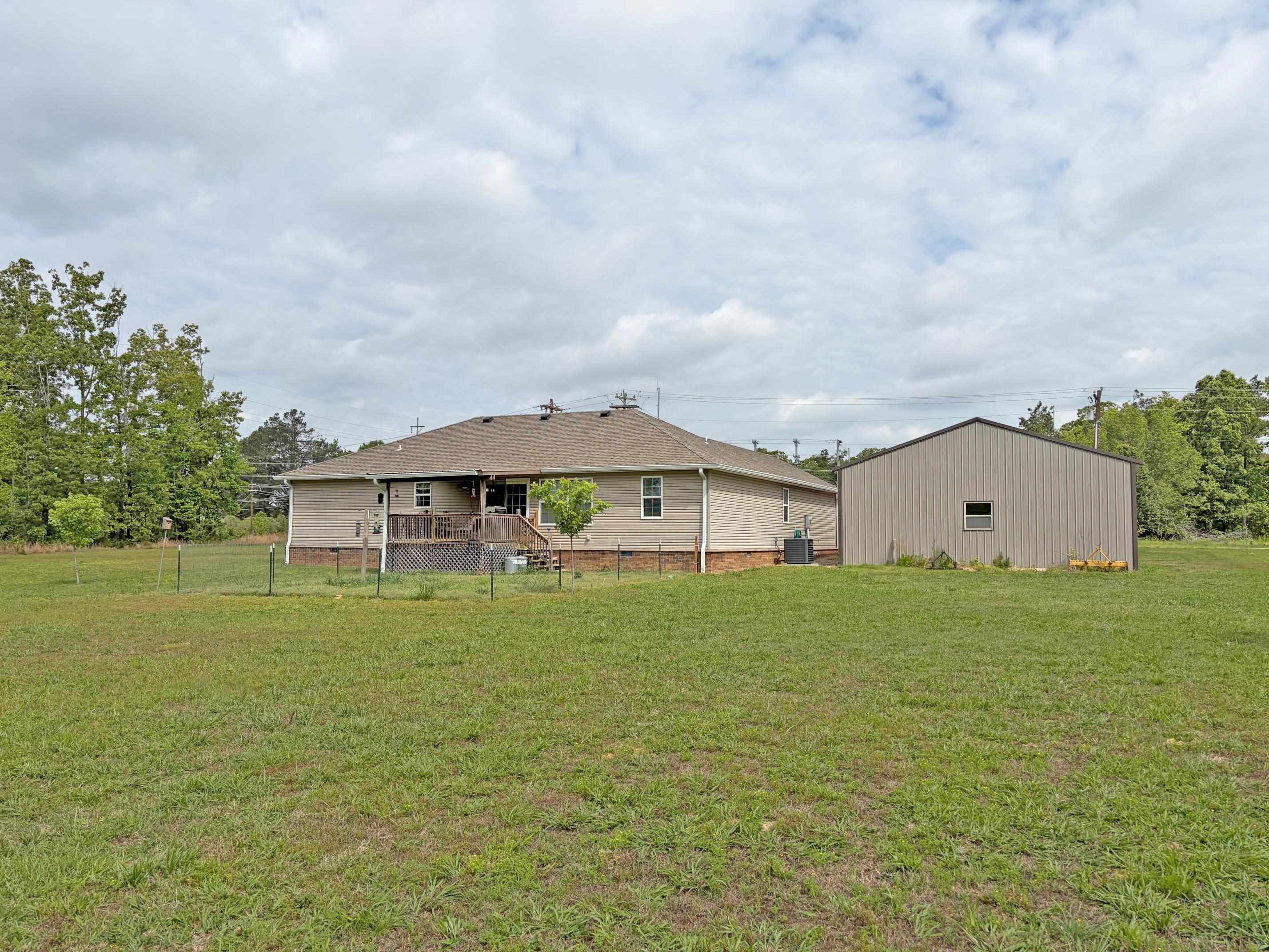 1255 Elm Road Adamsville, TN 38310 - Photo 29 of 32 a house with yard in front of it