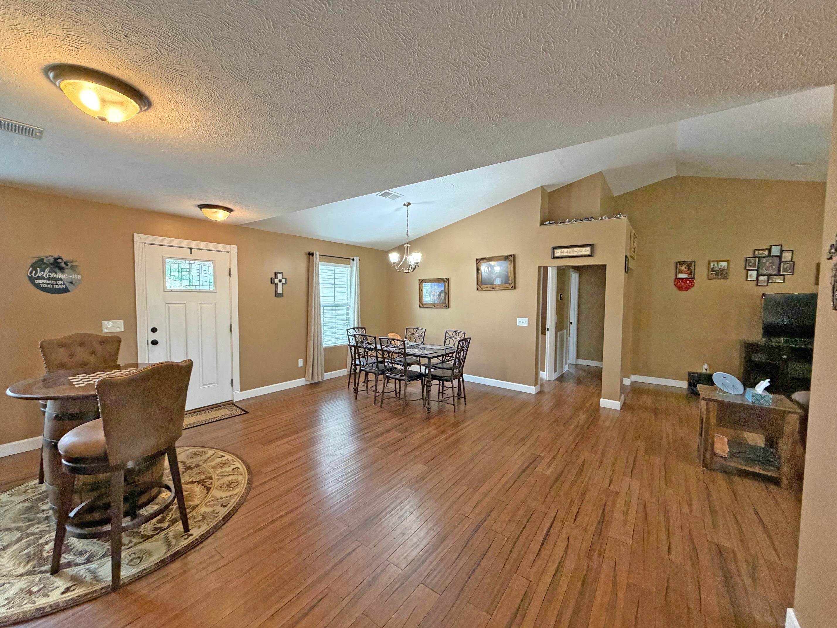 1255 Elm Road Adamsville, TN 38310 - Photo 5 of 32 a living room with furniture and wooden floor