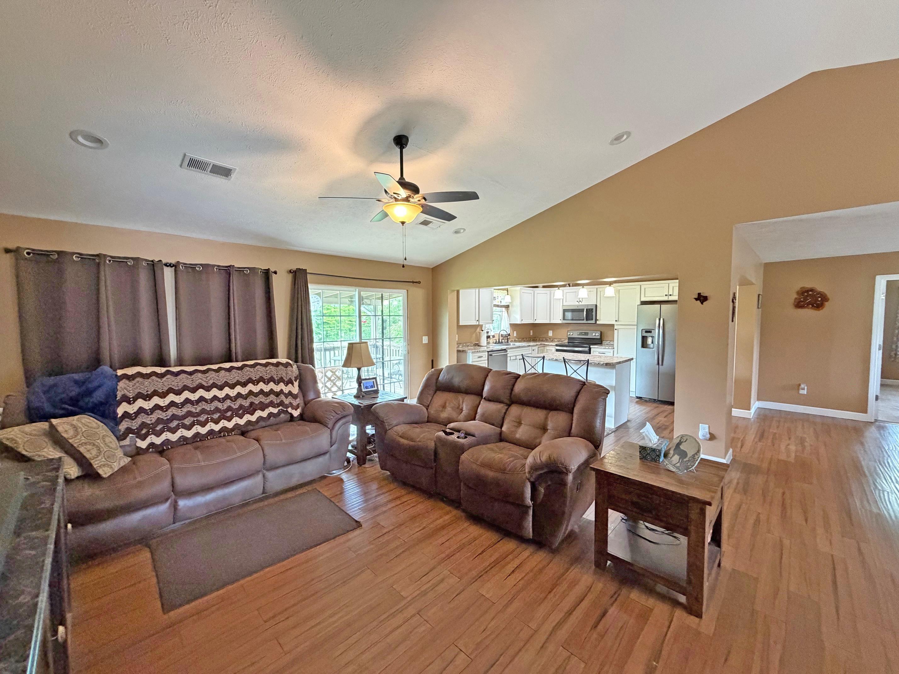 1255 Elm Road Adamsville, TN 38310 - Photo 8 of 32 a living room with furniture and wooden floor