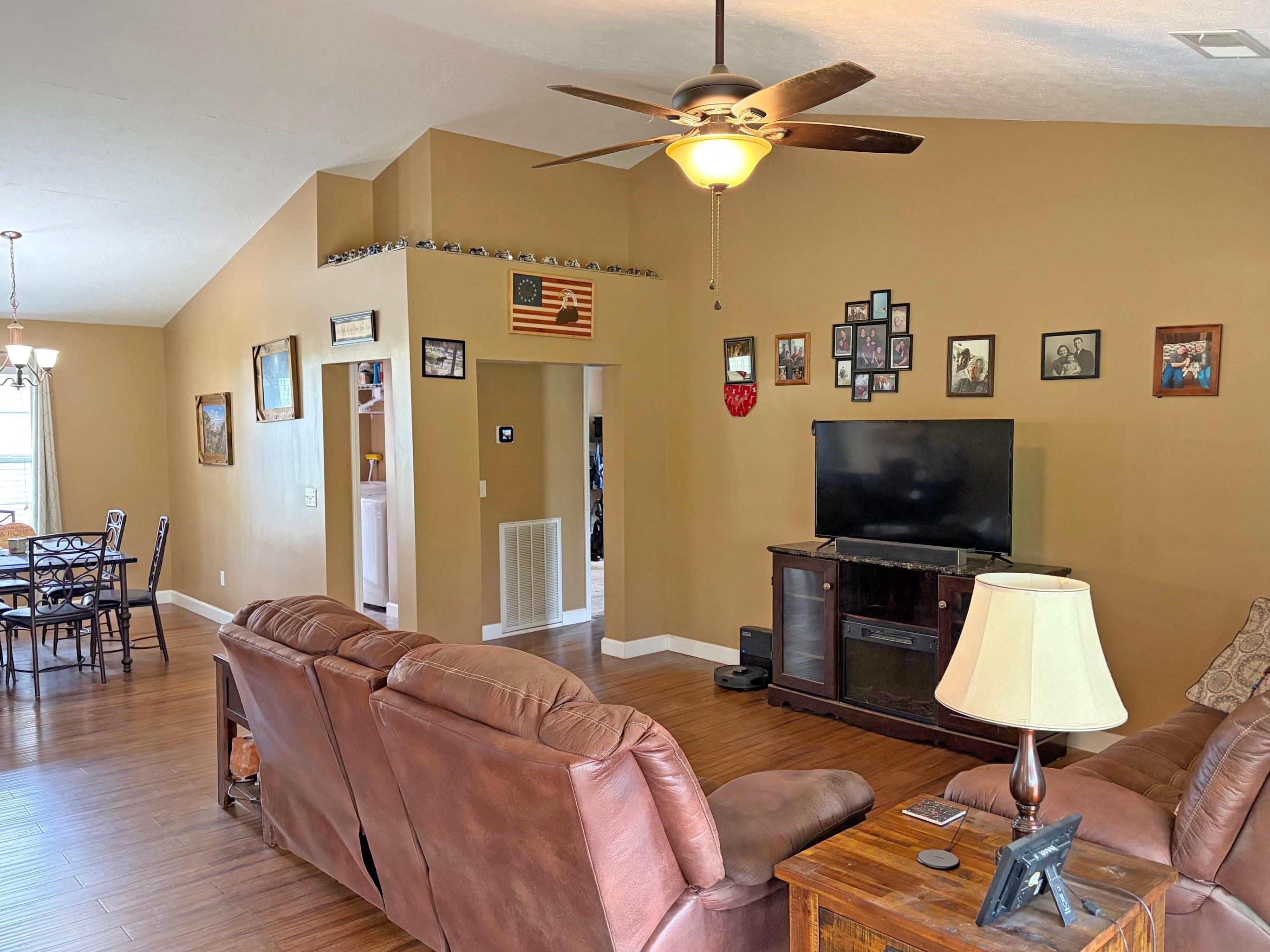 1255 Elm Road Adamsville, TN 38310 - Photo 10 of 32 a living room with furniture and a flat screen tv