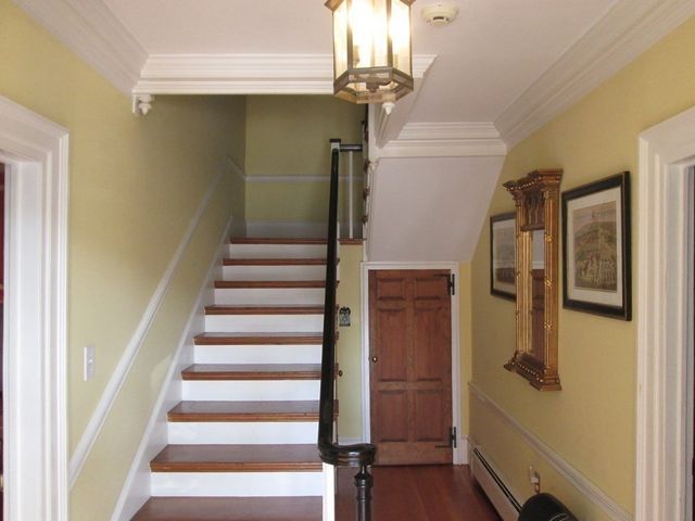 a view of entryway with wooden floor