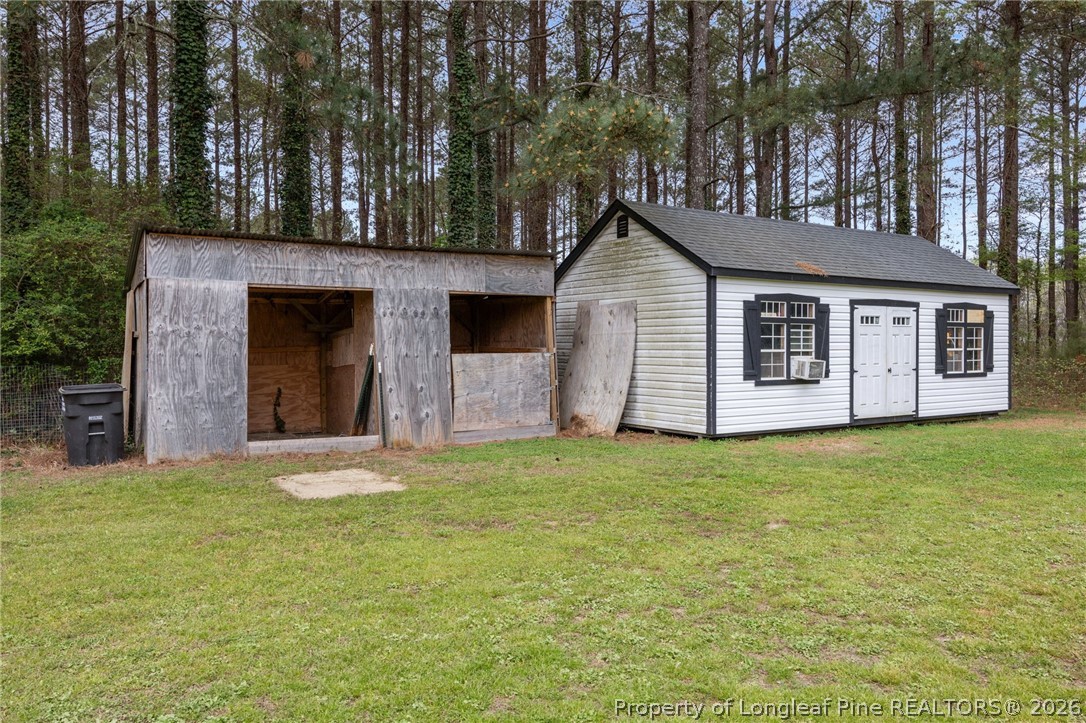 2252 Old Stage Road South Erwin, NC 28339 - Photo 36 of 47 a front view of a house with a garden