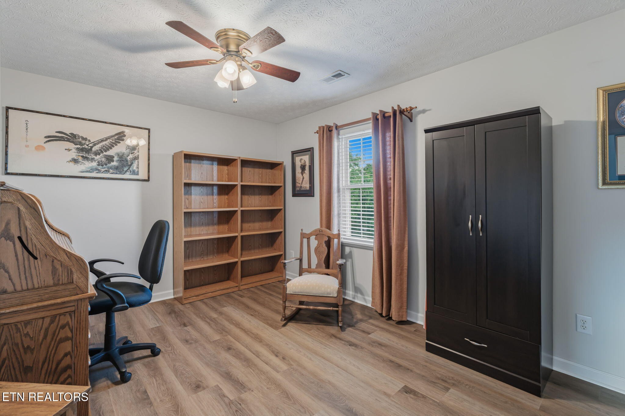 7030 Westerly Winds Road Knoxville, TN 37931 - Photo 29 of 40 a workspace with a chair