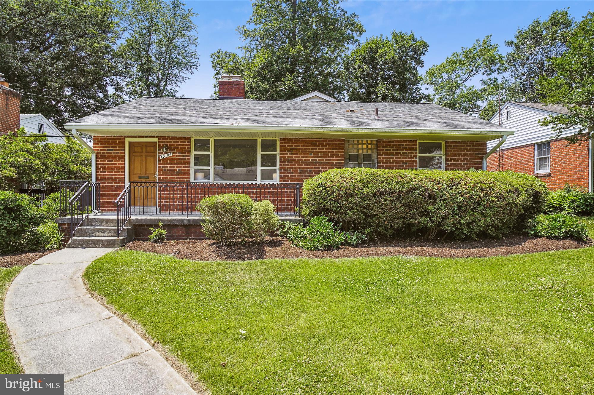 10106 Portland Place Silver Spring, MD 20901 - Photo 1 of 38 a front view of a house with a yard
