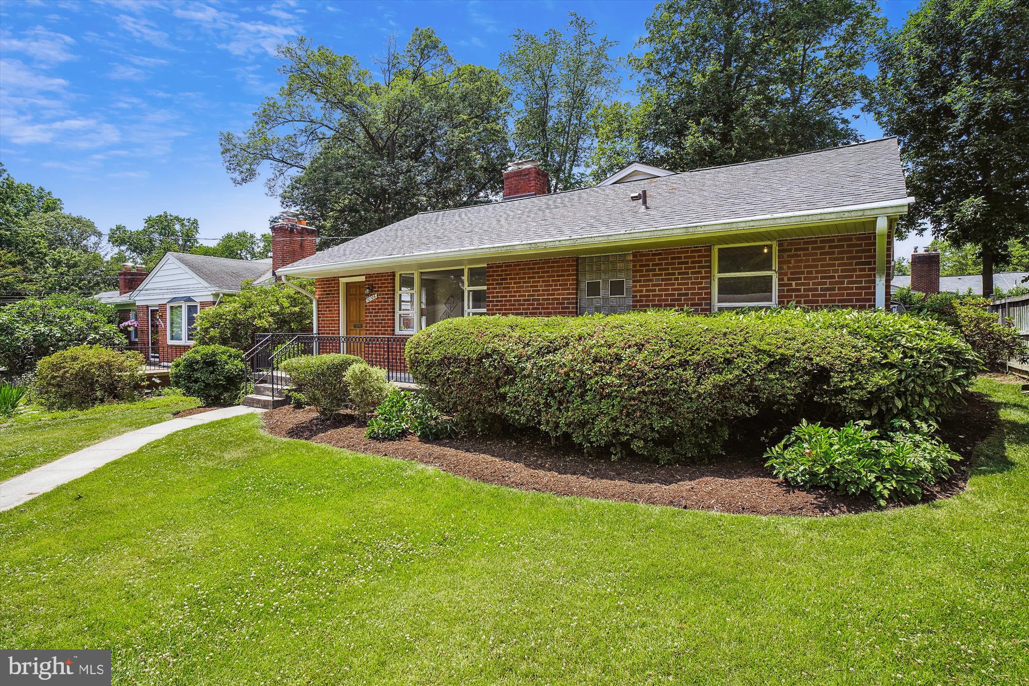 10106 Portland Place Silver Spring, MD 20901 - Photo 2 of 38 a front view of a house with a yard
