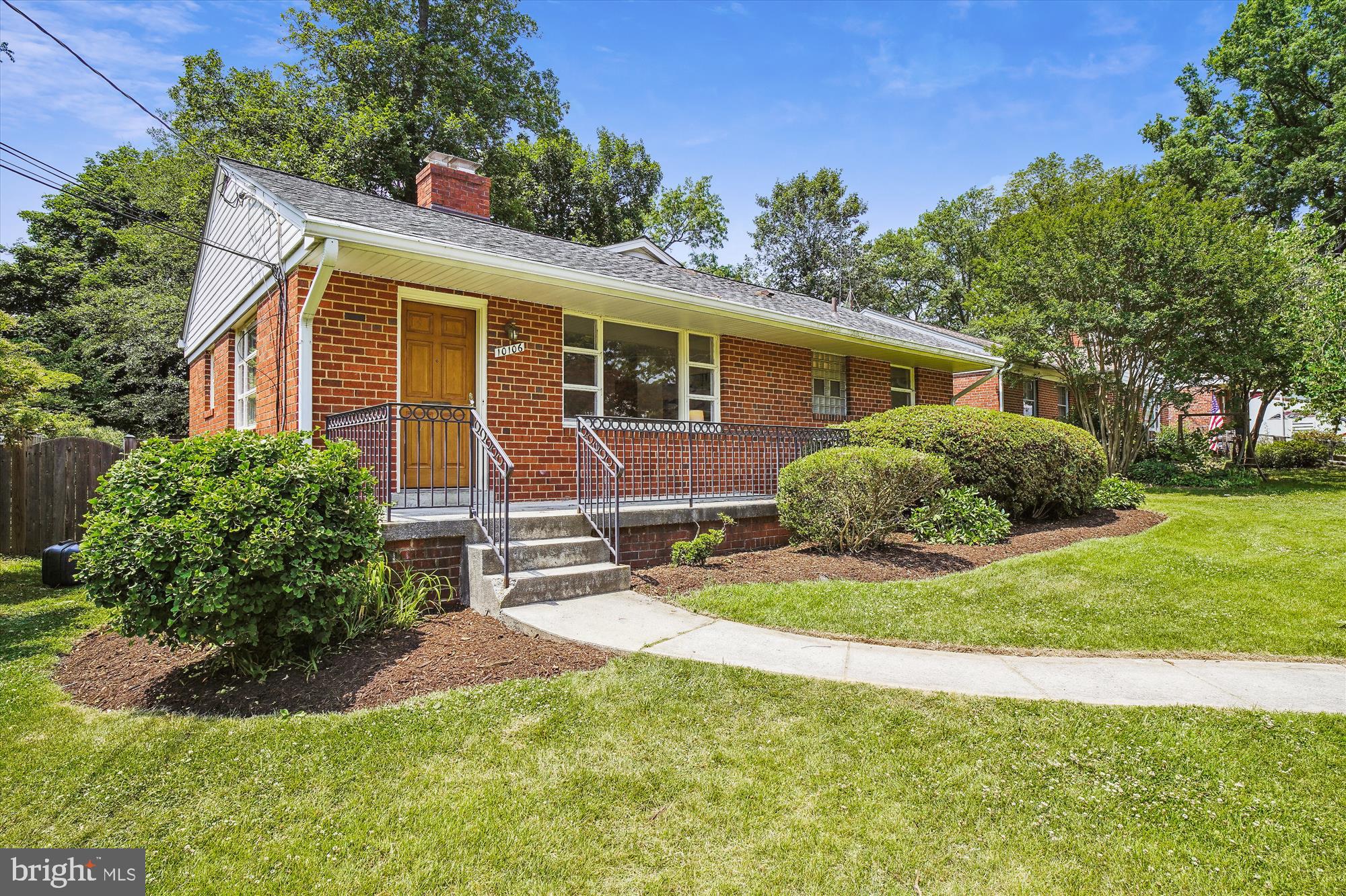 10106 Portland Place Silver Spring, MD 20901 - Photo 3 of 38 a view of a house with a yard and plants