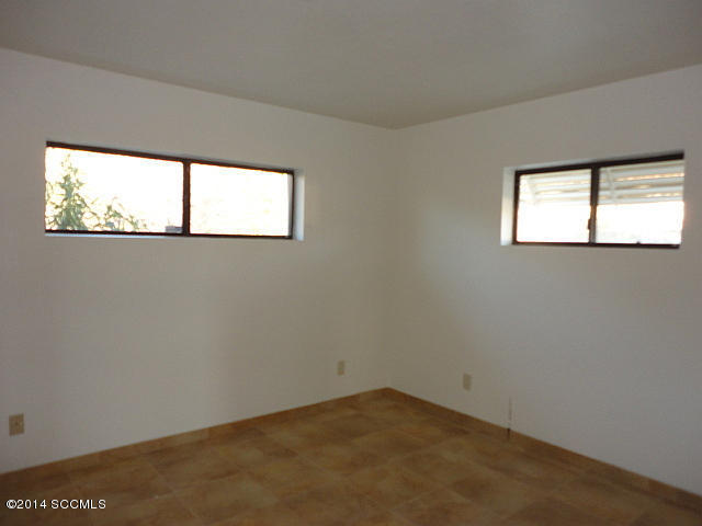 1363 Tequila Court Rio Rico, AZ 85648 - Photo 7 of 14 an empty room with a window