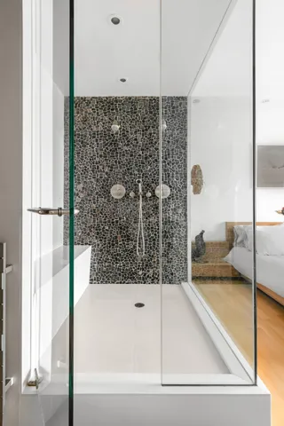 a bathroom with a bathtub and a shower