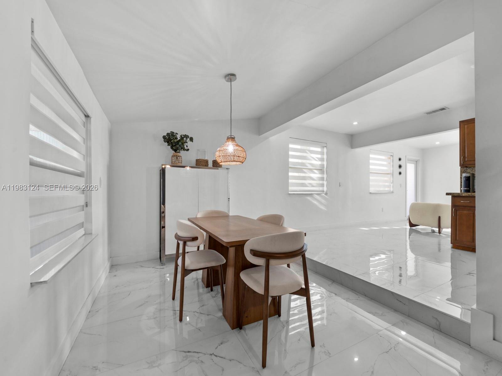 120 West 50th Street Hialeah, FL 33012 - Photo 18 of 37 a view of a dining room with furniture and window