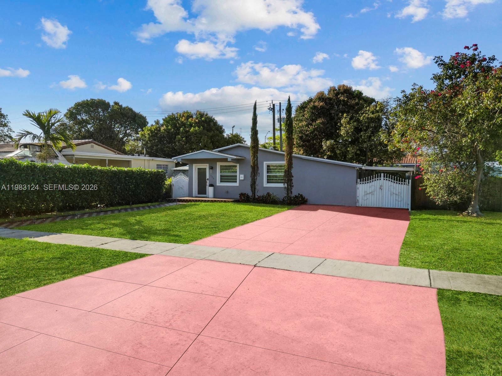 120 West 50th Street Hialeah, FL 33012 - Photo 2 of 37 a view of a yard with a house