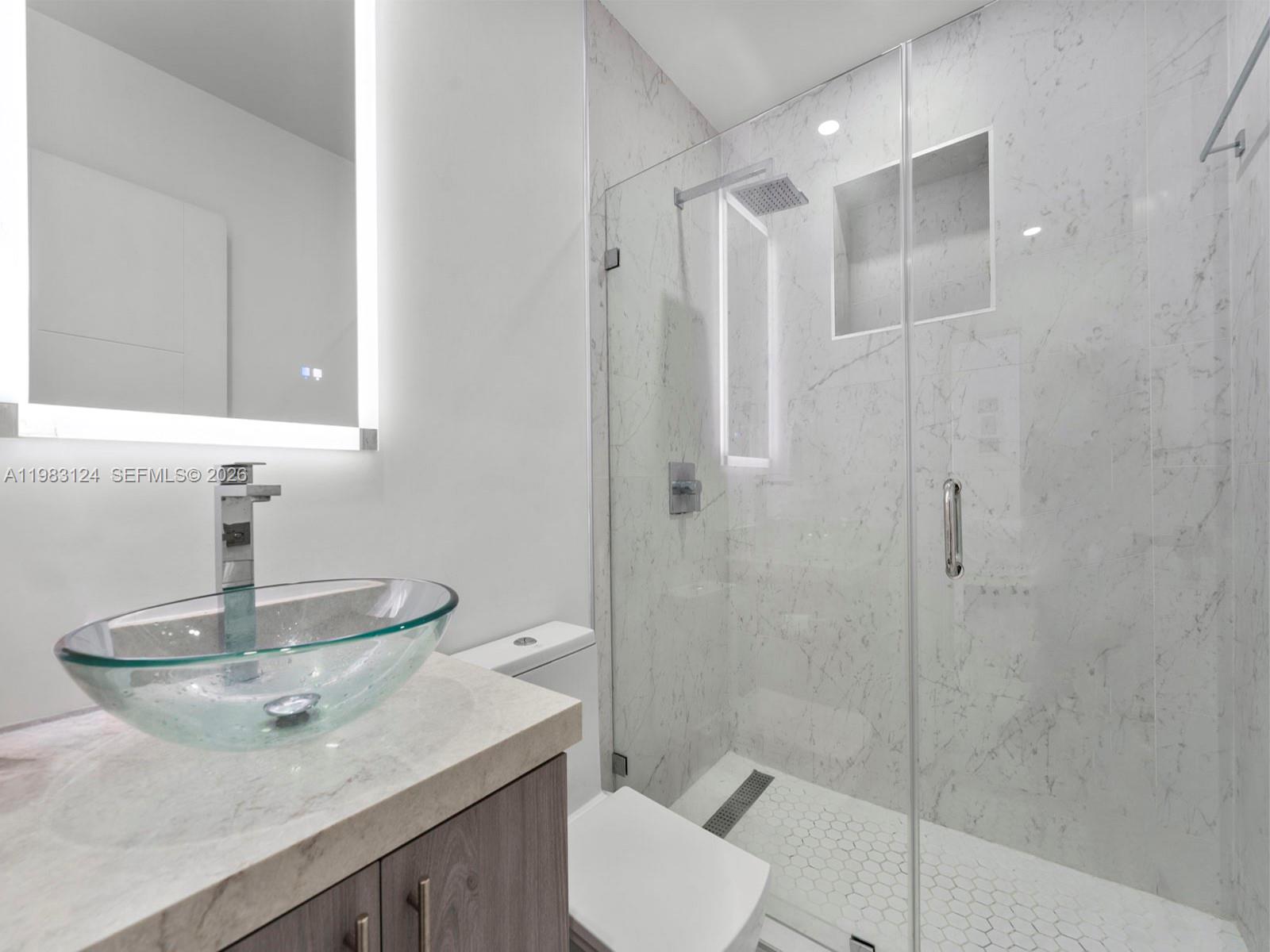 120 West 50th Street Hialeah, FL 33012 - Photo 24 of 37 a bathroom with a sink toilet and shower