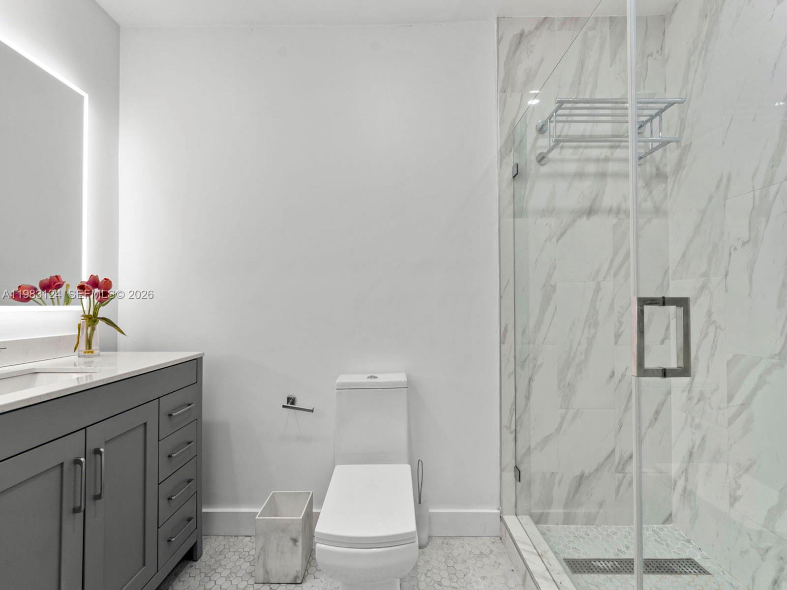 120 West 50th Street Hialeah, FL 33012 - Photo 30 of 37 a bathroom with a granite countertop sink a toilet and shower