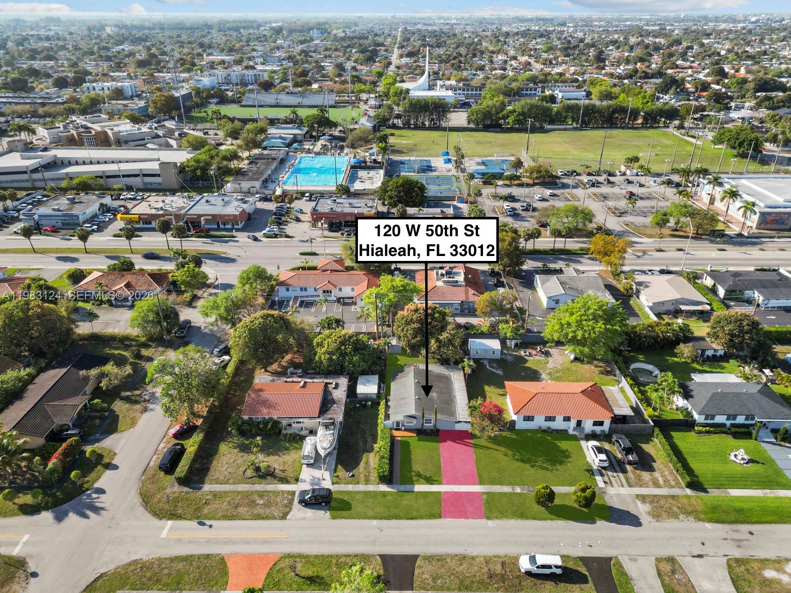 120 West 50th Street Hialeah, FL 33012 - Photo 5 of 37 an aerial view of residential building and lake