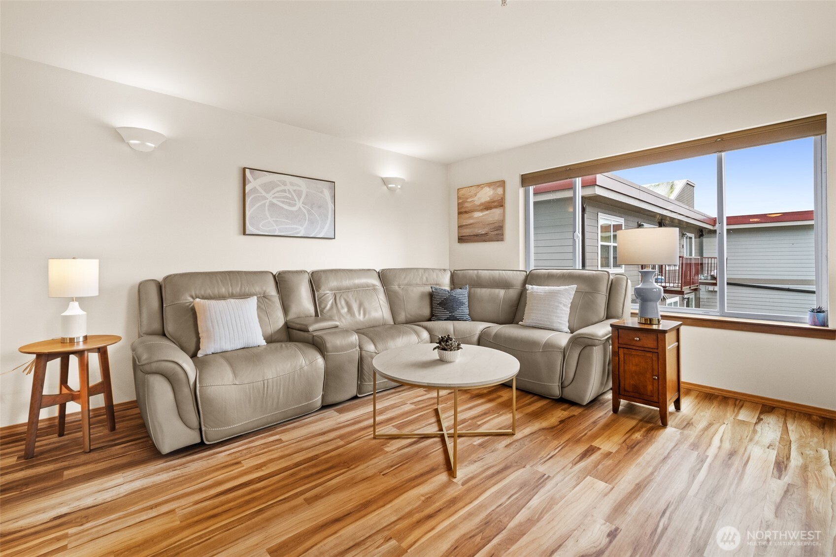 1011 Bancroft Street, Unit 204 Bellingham, WA 98225 - Photo 12 of 32 a living room with couches and kitchen view with wooden floor