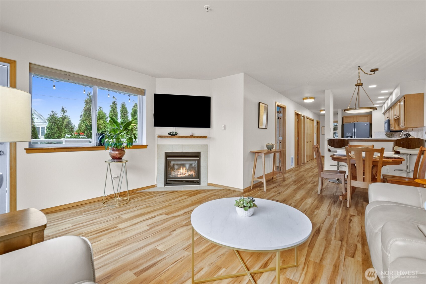 1011 Bancroft Street, Unit 204 Bellingham, WA 98225 - Photo 13 of 32 a living room with furniture a fireplace and a flat screen tv