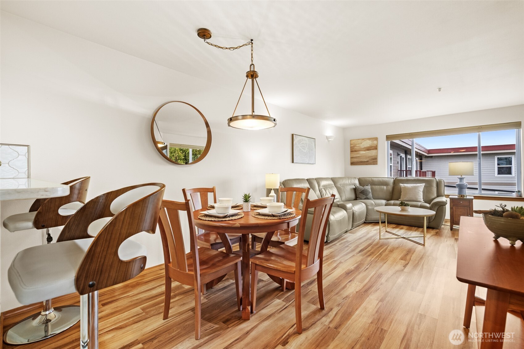1011 Bancroft Street, Unit 204 Bellingham, WA 98225 - Photo 8 of 32 a dining room with wooden floor a glass table and chairs
