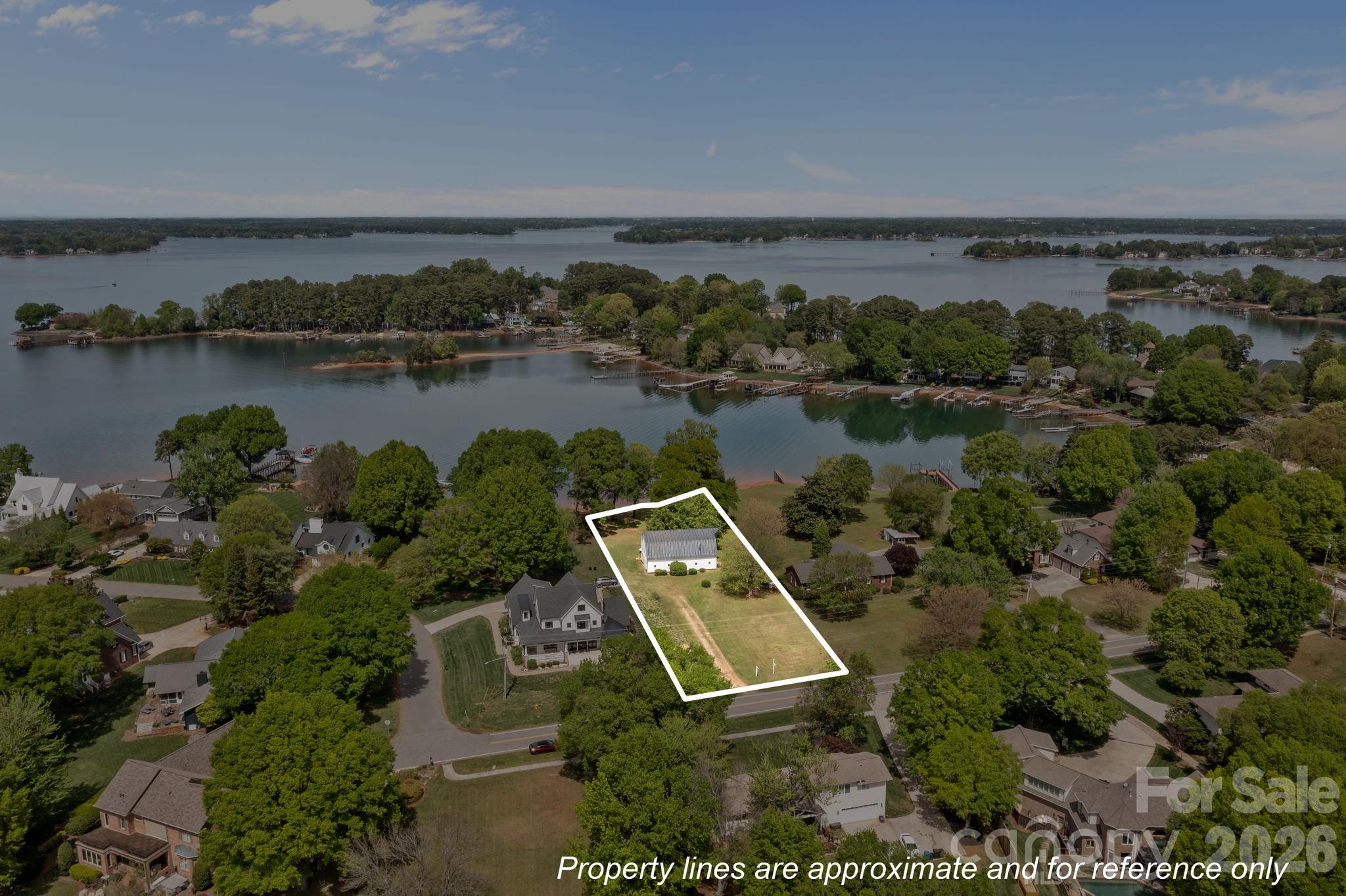 21422 Bethel Church Road Cornelius, NC 28031 - Photo 15 of 19 an aerial view of a house with a yard and lake view