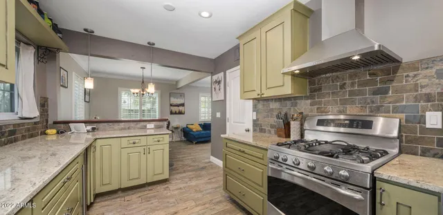 a kitchen that has a stove and a sink