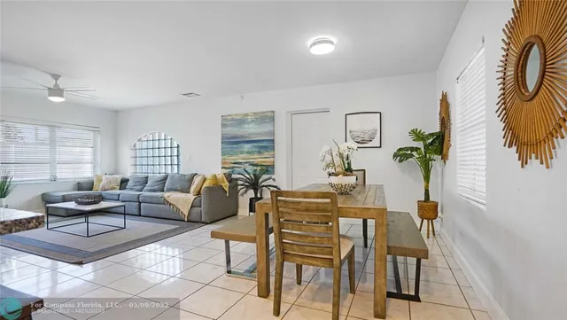 a kitchen with granite countertop kitchen island a stove a table and chairs in it