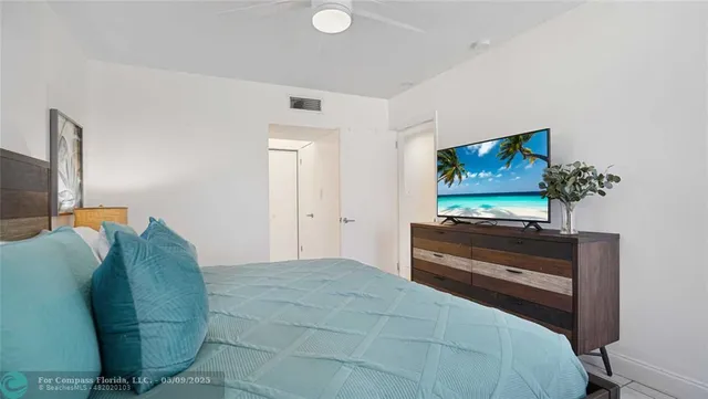a bathroom with a granite countertop sink a toilet and a shower