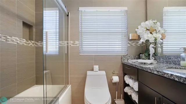 a bedroom with a bed dresser and a window