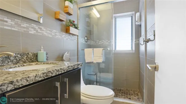 a bedroom with a bed and flat screen tv