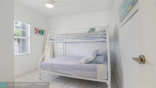 a bedroom with a large bed and a dresser