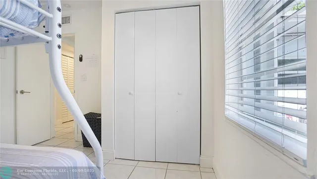 a patio with table and chairs