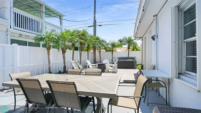 a view of a house with a yard and a porch