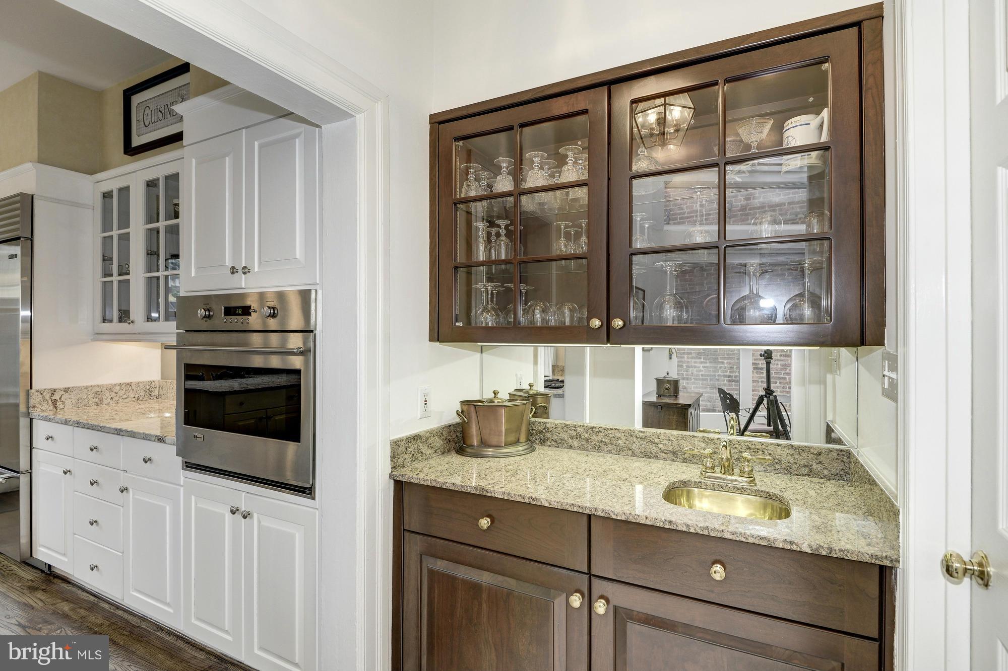 1616 S Street Northwest Washington, DC 20009 - Photo 15 of 30 a bathroom with a granite countertop sink and a mirror
