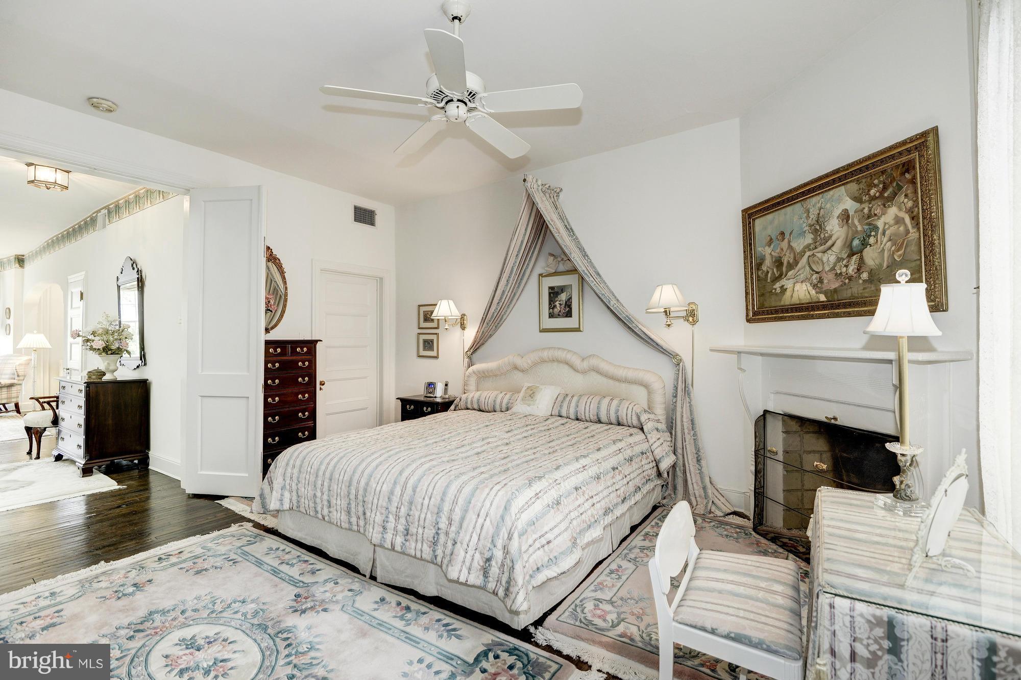 1616 S Street Northwest Washington, DC 20009 - Photo 17 of 30 a bedroom with a bed and a fireplace