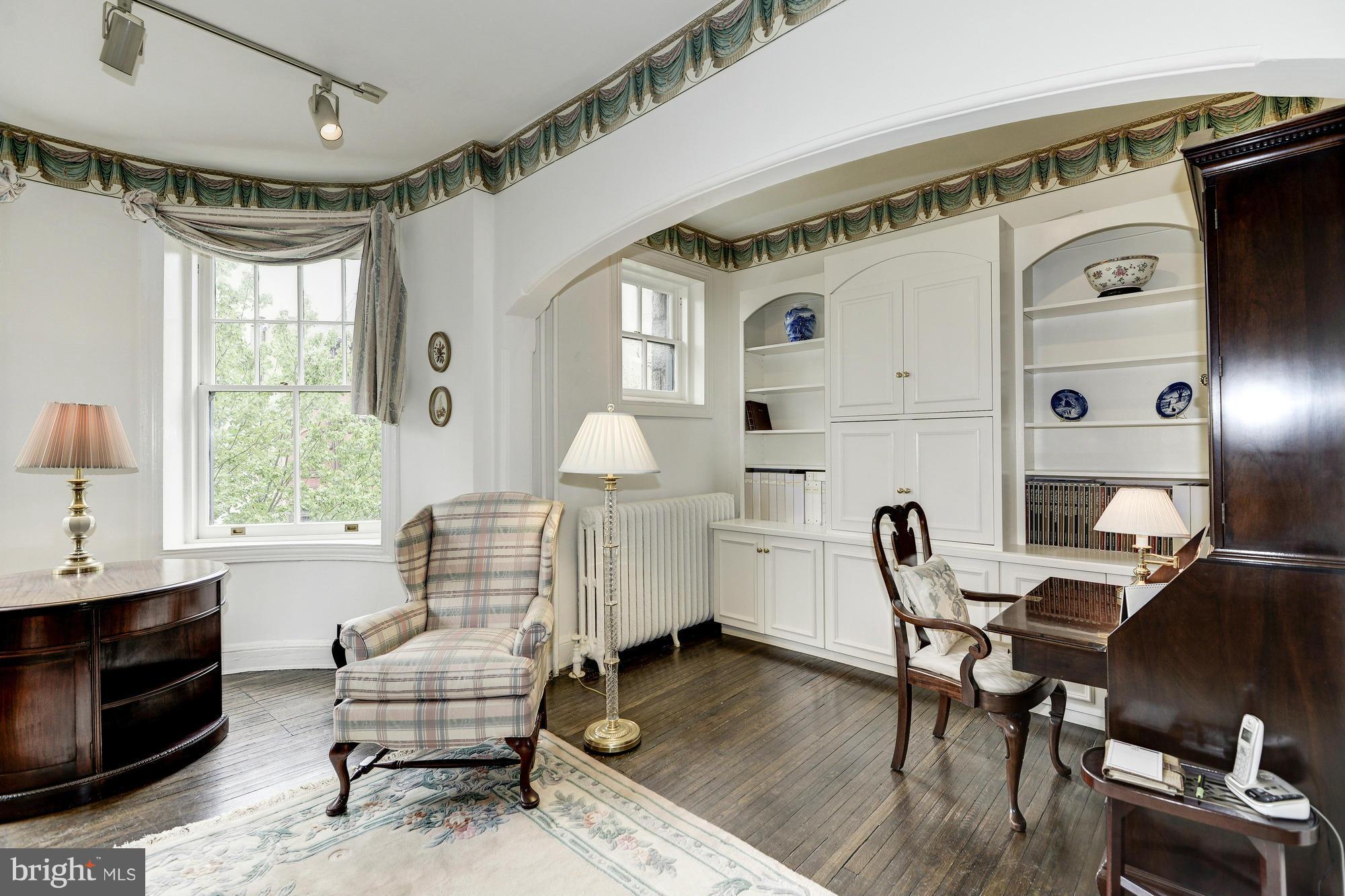 1616 S Street Northwest Washington, DC 20009 - Photo 20 of 30 a living room with furniture and a wooden floor