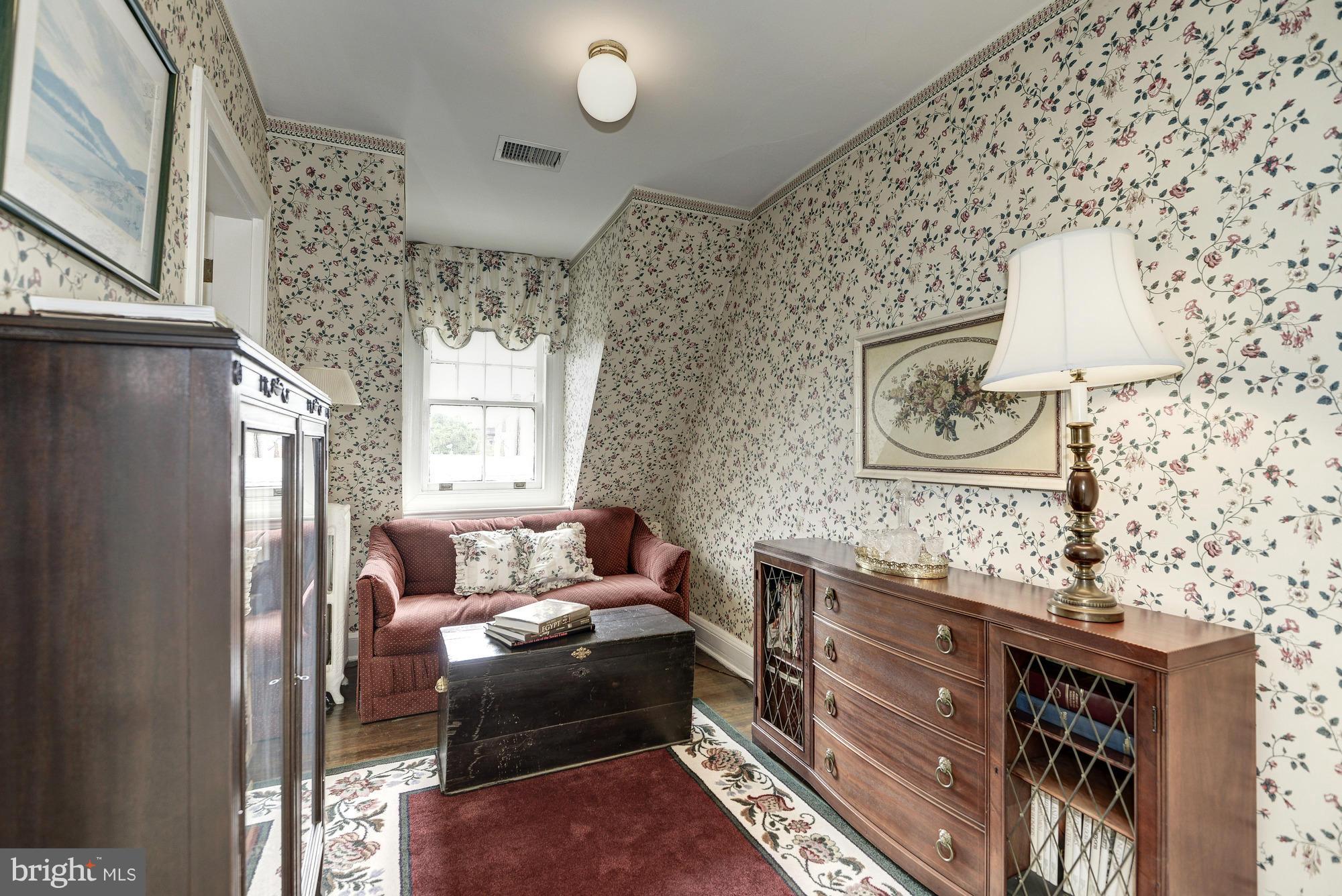 1616 S Street Northwest Washington, DC 20009 - Photo 24 of 30 a living room with furniture and a window