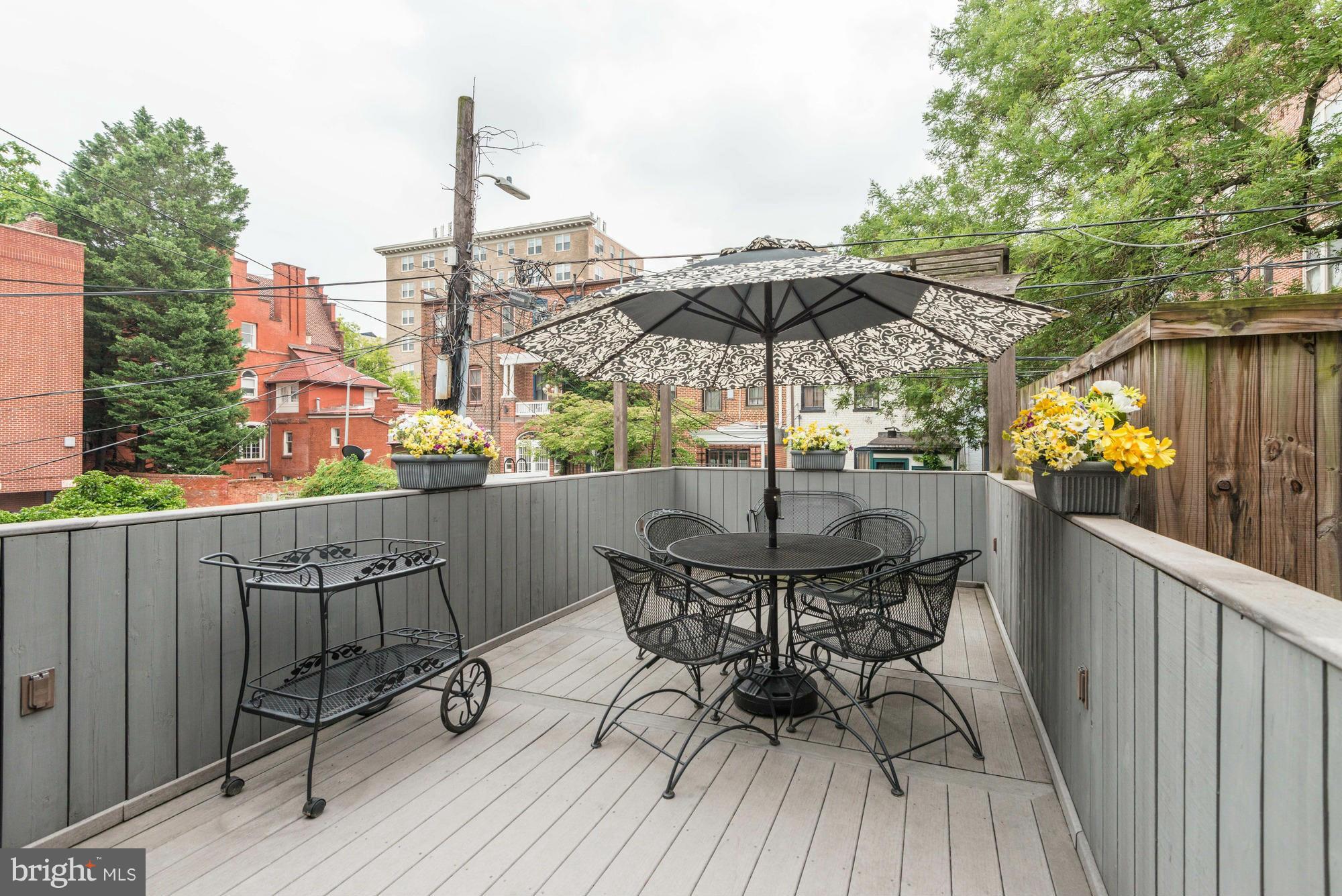 1616 S Street Northwest Washington, DC 20009 - Photo 28 of 30 a view of balcony with furniture and wooden deck
