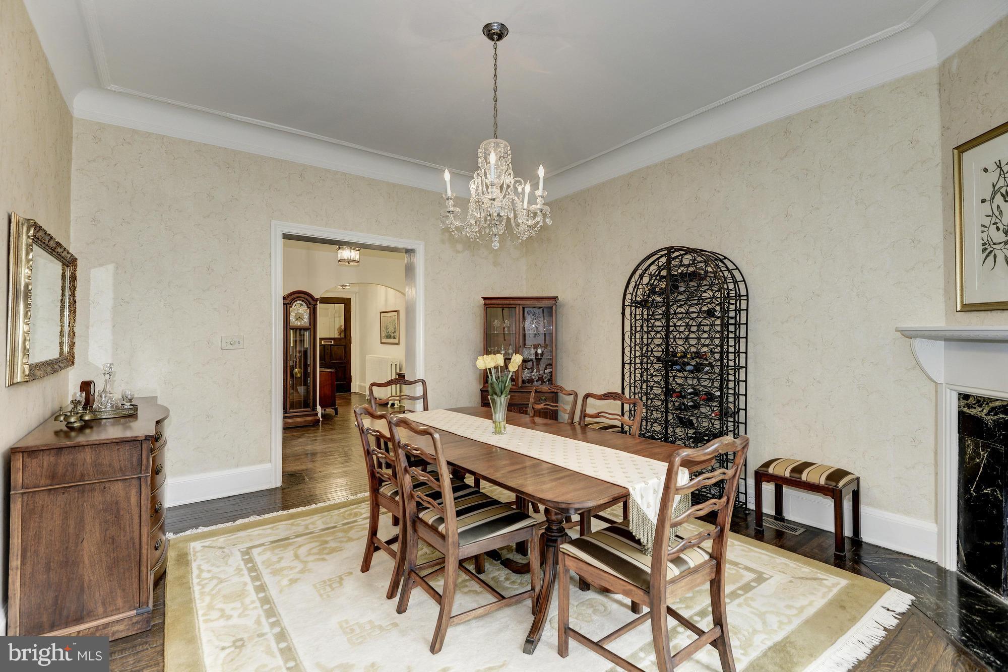 1616 S Street Northwest Washington, DC 20009 - Photo 9 of 30 a view of a dining room with furniture and chandelier