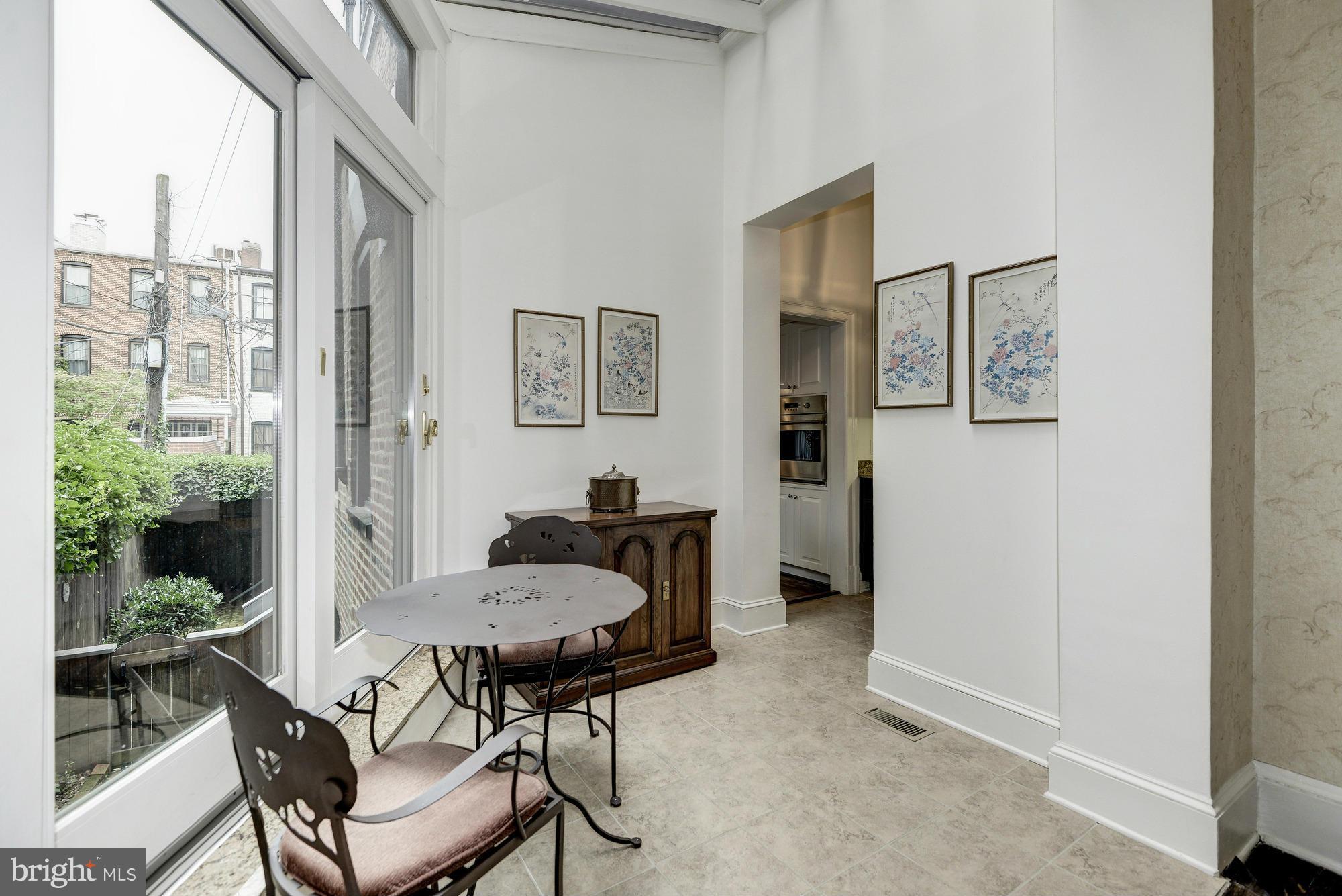1616 S Street Northwest Washington, DC 20009 - Photo 10 of 30 a view of a livingroom with furniture and a window