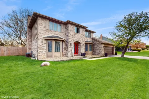 a view of a house with a backyard