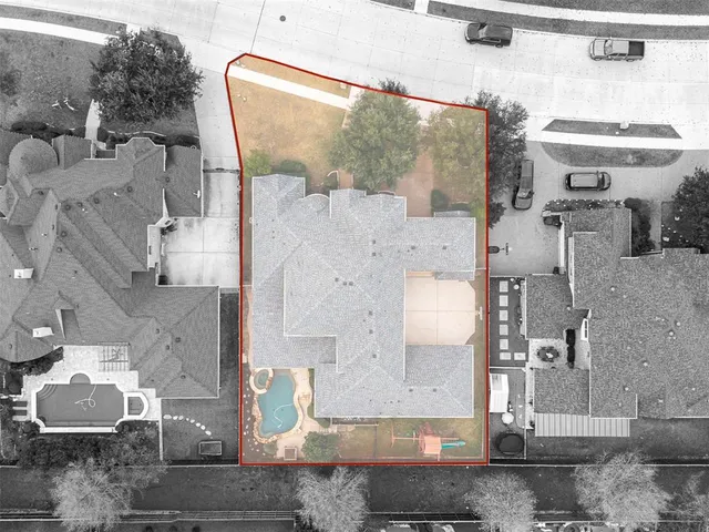 an aerial view of residential houses with outdoor space