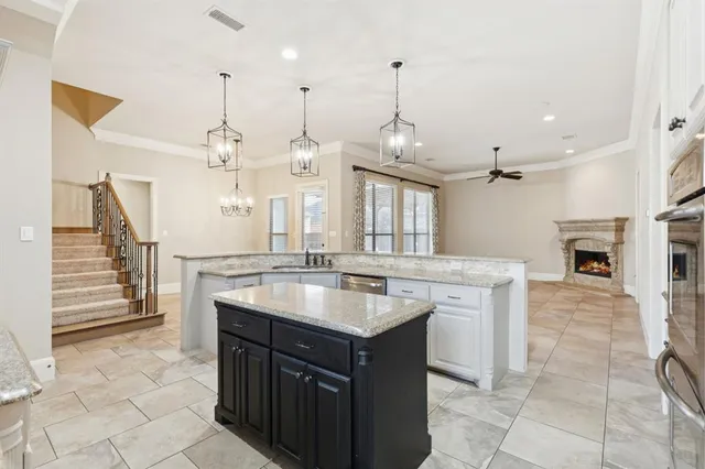 a kitchen with kitchen island a sink a counter and appliances
