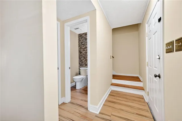 a view of a bathroom from the hallway