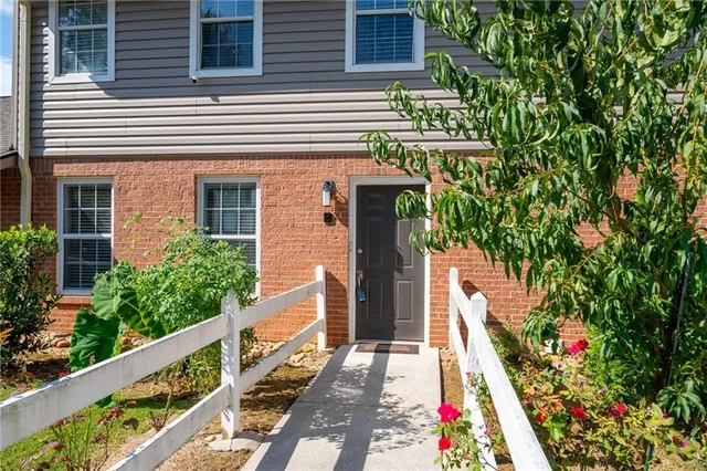 a view of a house with fountain and wooden floor