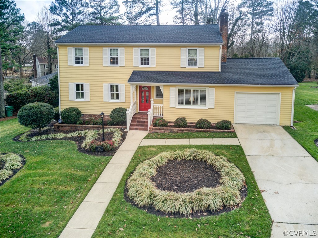 104 Tudor Road Colonial Heights, VA 23834 - Photo 1 of 50 a front view of a house with a yard