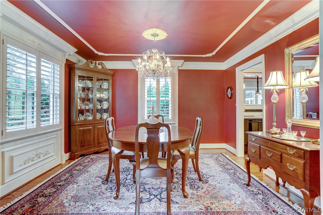 104 Tudor Road Colonial Heights, VA 23834 - Photo 13 of 50 a view of a dining room with furniture window and wooden floor